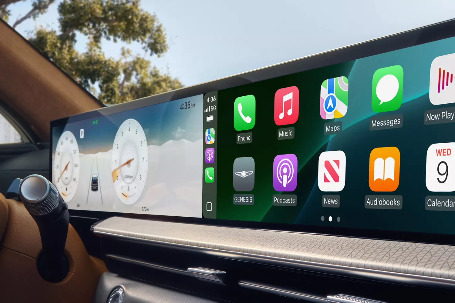 Close up interior shot of 27-inch OLED display featuring split screen view of odometer and app icons